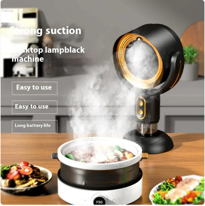Top-down view of a kitchen setup with a lampblack machine emitting smoke over a pot of food.